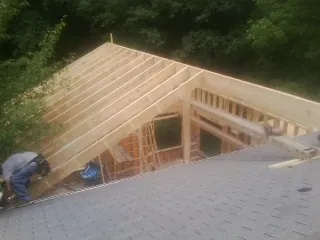 Framing a new roof addition that ties into an existing shingle roof in Oldsmar